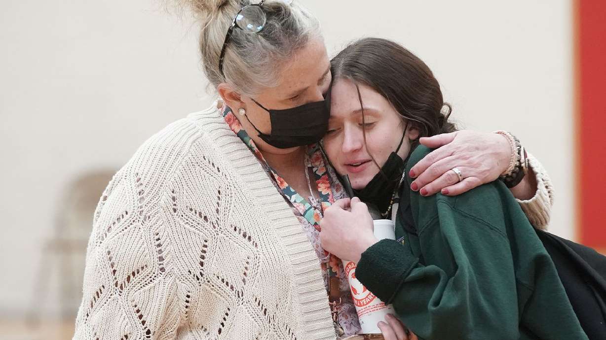 Viewmont High School student Aubrey Weeks is hugged by her mother and Davis School District COVID aide Brenda Weeks after her COVID-19 test at the school in Bountiful on Wednesday. The school conducted testing on Wednesday after recent COVID-19 cases among students pushed it past the "test to stay” threshold, where they are required to test students.