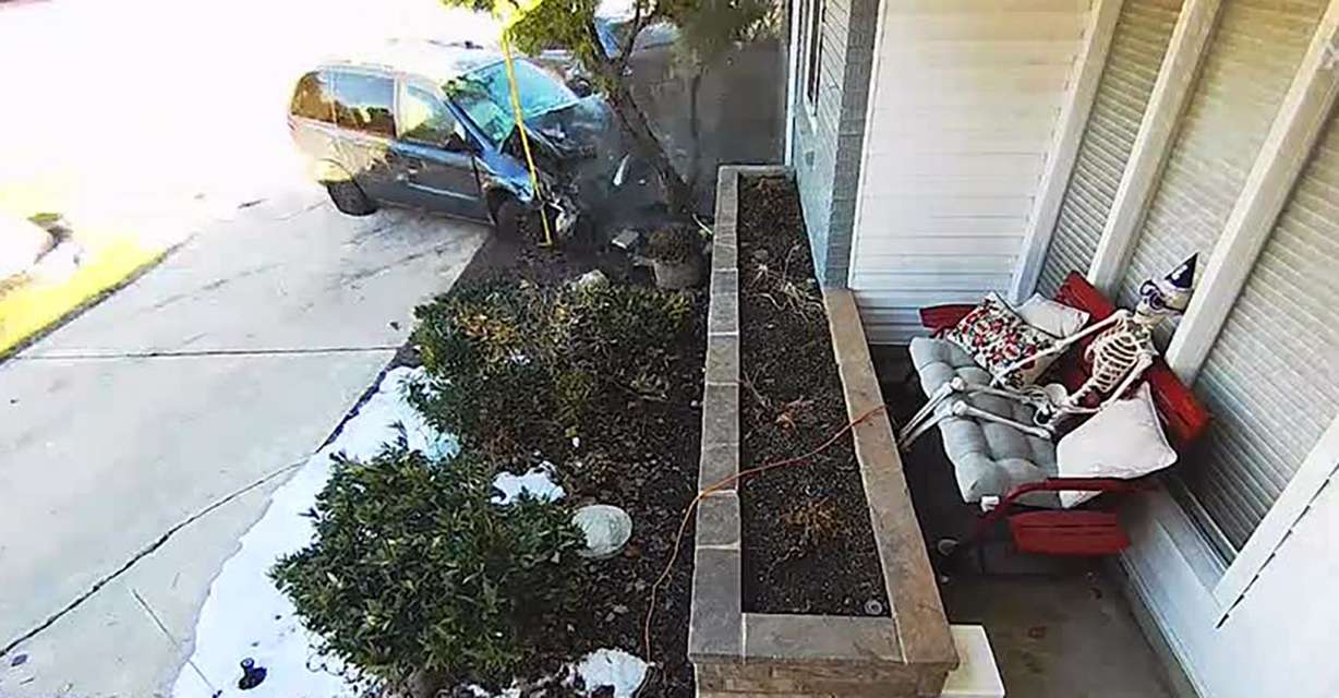 A vehicle comes to rest after crashing on the property of Hailey and Randy Turner in Layton. The Turners want changes after several vehicles have crashed there.