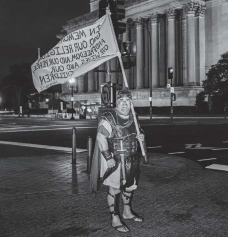 A man the FBI has identified as Nathan Wayne Entrekin
poses near the U.S. Capitol on Jan. 6, 2021. The FBI says the photo
was posted publicly on Instagram. Entrekin was arrested in July and
is scheduled to make a plea agreement in federal court on
Friday.