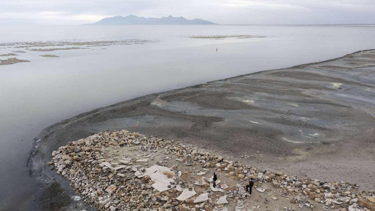 Tourists visit the Great Salt Lake on Nov. 19, 2021. Utah environmental groups said Thursday the effort to save the drying lake may serve as a blueprint for future conservation goals.