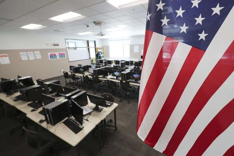 An empty classroom at Mount Jordan Middle School in
Sandy is pictured on Tuesday, April 14, 2020, after COVID-19 forced
schools to pivot to remote learning.