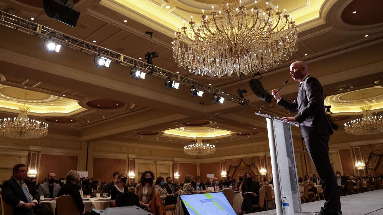 Gov. Spencer Cox speaks at the 2022 Utah Economic Outlook & Public Policy Summit at the Grand America in Salt Lake City on Thursday.