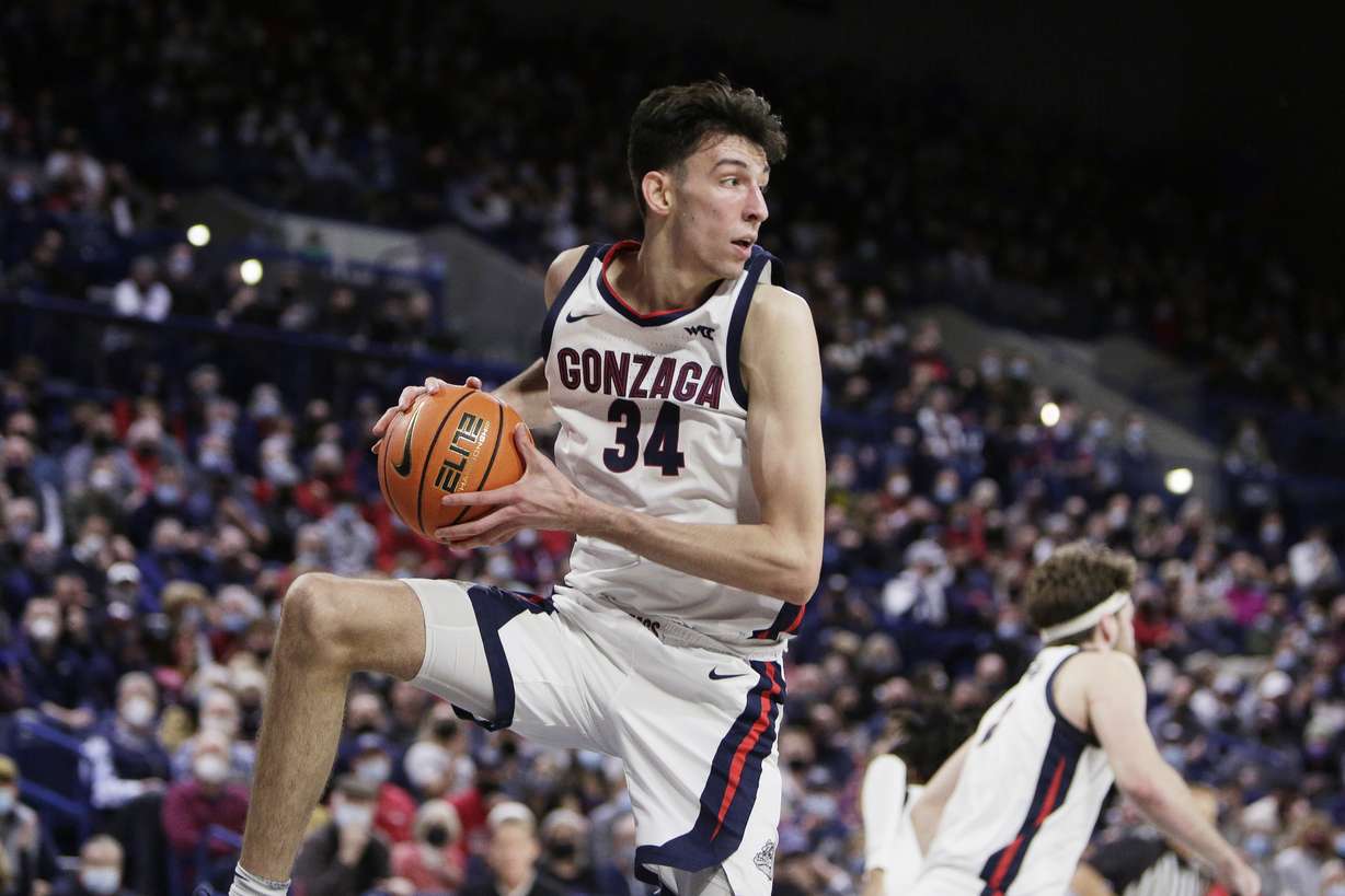 Gonzaga center Chet Holmgren secures a rebound during the first half of an NCAA college basketball game against BYU, Thursday, Jan. 13, 2022, in Spokane, Wash.