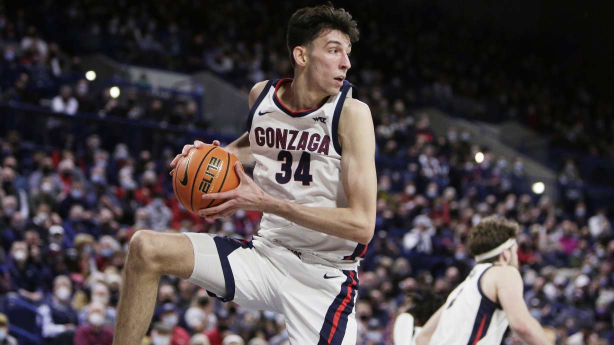 Gonzaga center Chet Holmgren secures a rebound during the first half of an NCAA college basketball game against BYU, Thursday, Jan. 13, 2022, in Spokane, Wash.