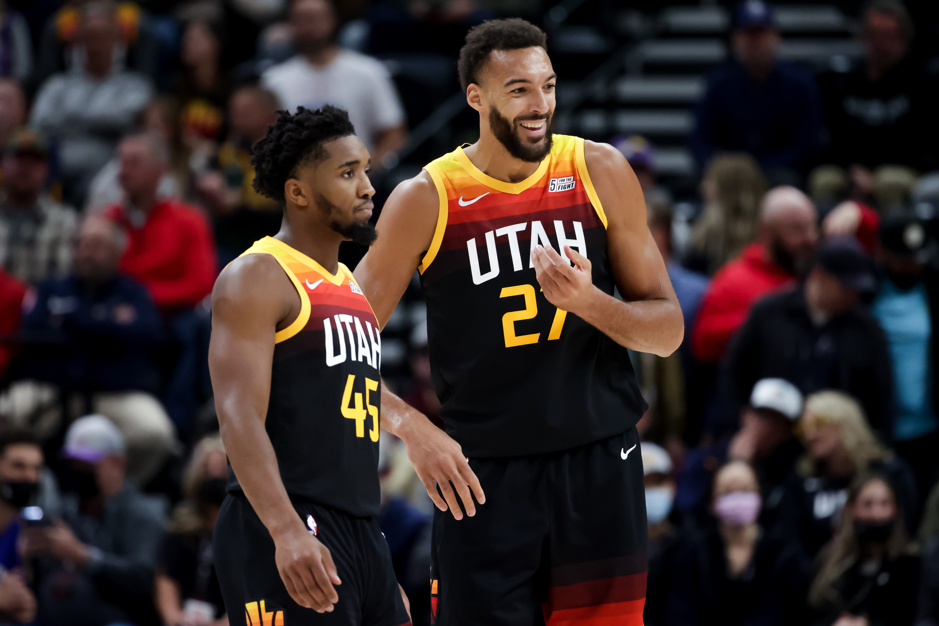 Utah Jazz guard Donovan Mitchell (45) and center Rudy Gobert (27) talk on the court during the game against the Philadelphia 76ers at Vivint Arena in Salt Lake City on Tuesday, Nov. 16, 2021.