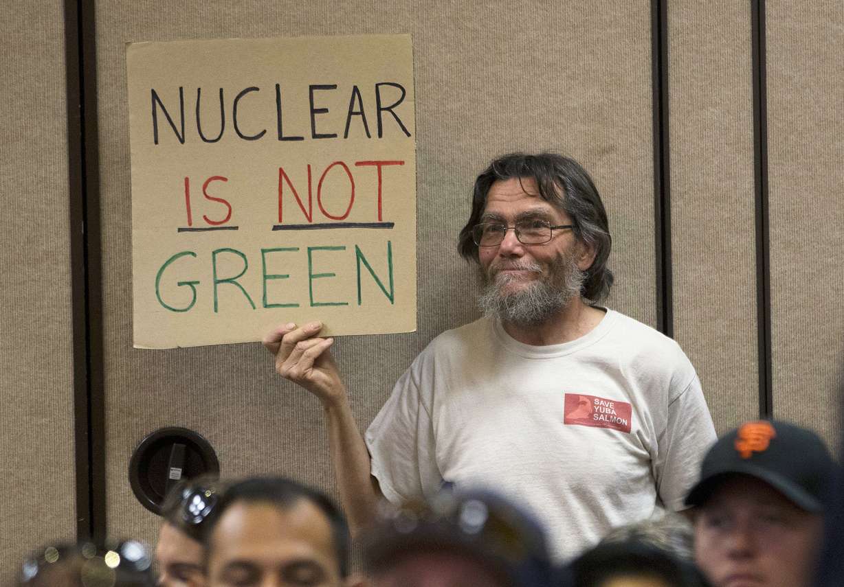 Peter Galbraith displays his opposition to a proposal to waive an environmental review of the Diablo Canyon Nuclear Power plant before renewing the plant's license, Tuesday, June 28, 2016, in Sacramento, Calif.