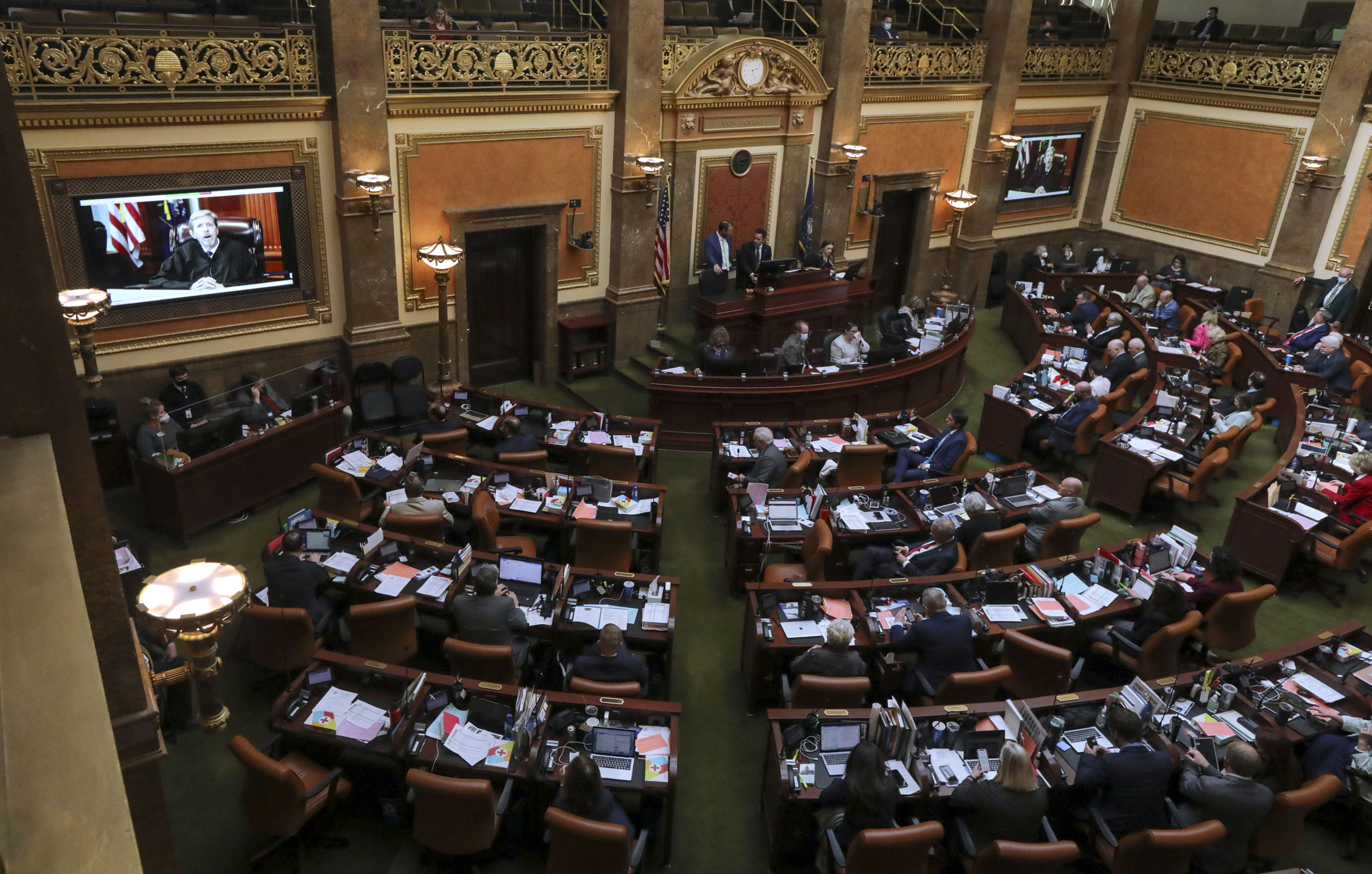 State representatives watch Chief Justice Matthew B. Durrant virtually deliver the State of the Judiciary in the House chamber at the Capitol in Salt Lake City on Tuesday.