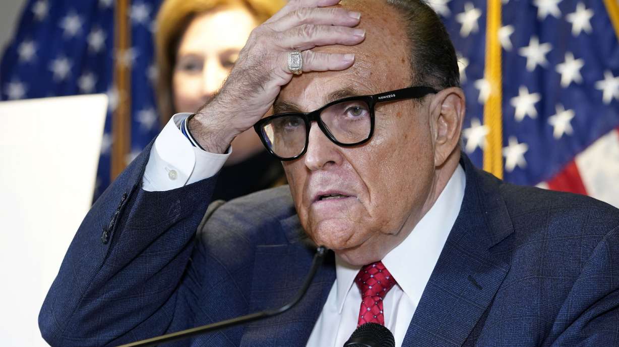 Former New York Mayor Rudy Giuliani speaks in Washington on Nov. 19, 2020. Sidney Powell stands behind. The House committee investigating the Capitol insurrection has issued subpoenas to some of former President Donald Trump's closest advisers, including Giuliani and Powell.