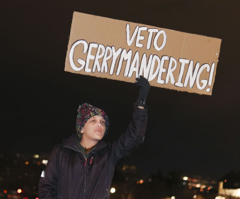 Amanda Roos of Lehi attends a rally in opposition to
the proposed congressional district maps at the Capitol in Salt
Lake City on Wednesday, Nov. 10, 2021.