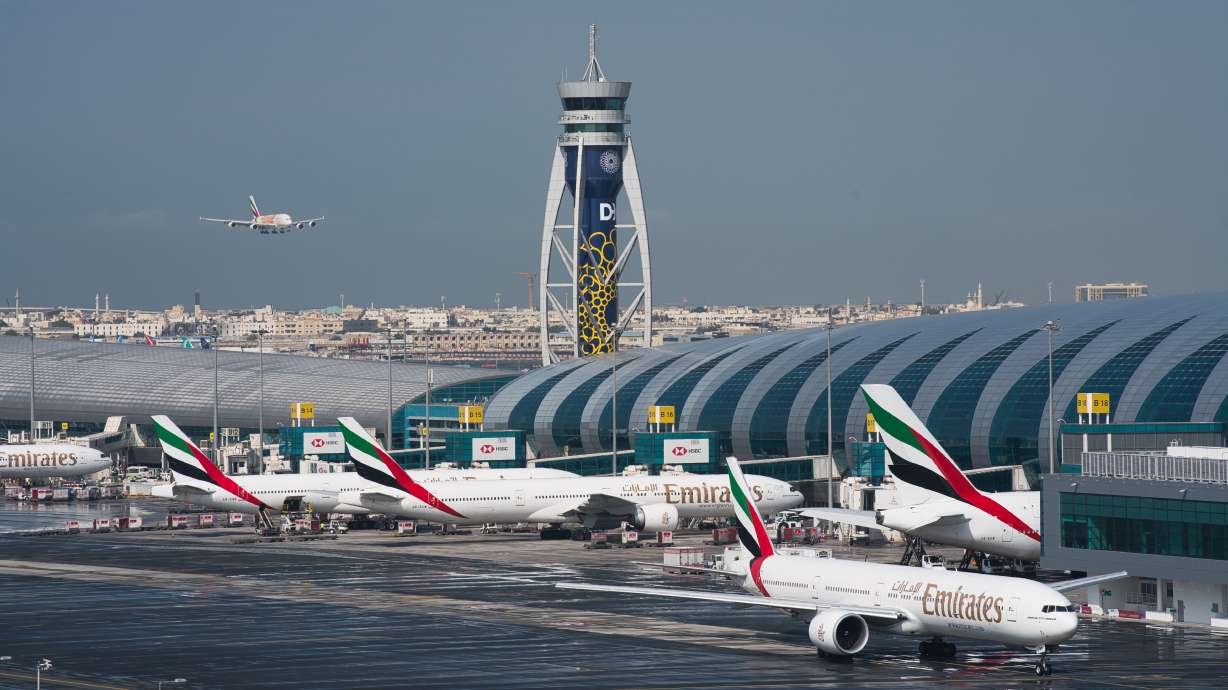 An Emirates jetliner comes in for landing in Dubai, United Arab Emirates, Dec. 11, 2019. Airlines across the world, including the long-haul carrier, Emirates, rushed Wednesday to cancel or change flights heading into the U.S. over an ongoing dispute about the rollout of 5G mobile phone technology near American airports.