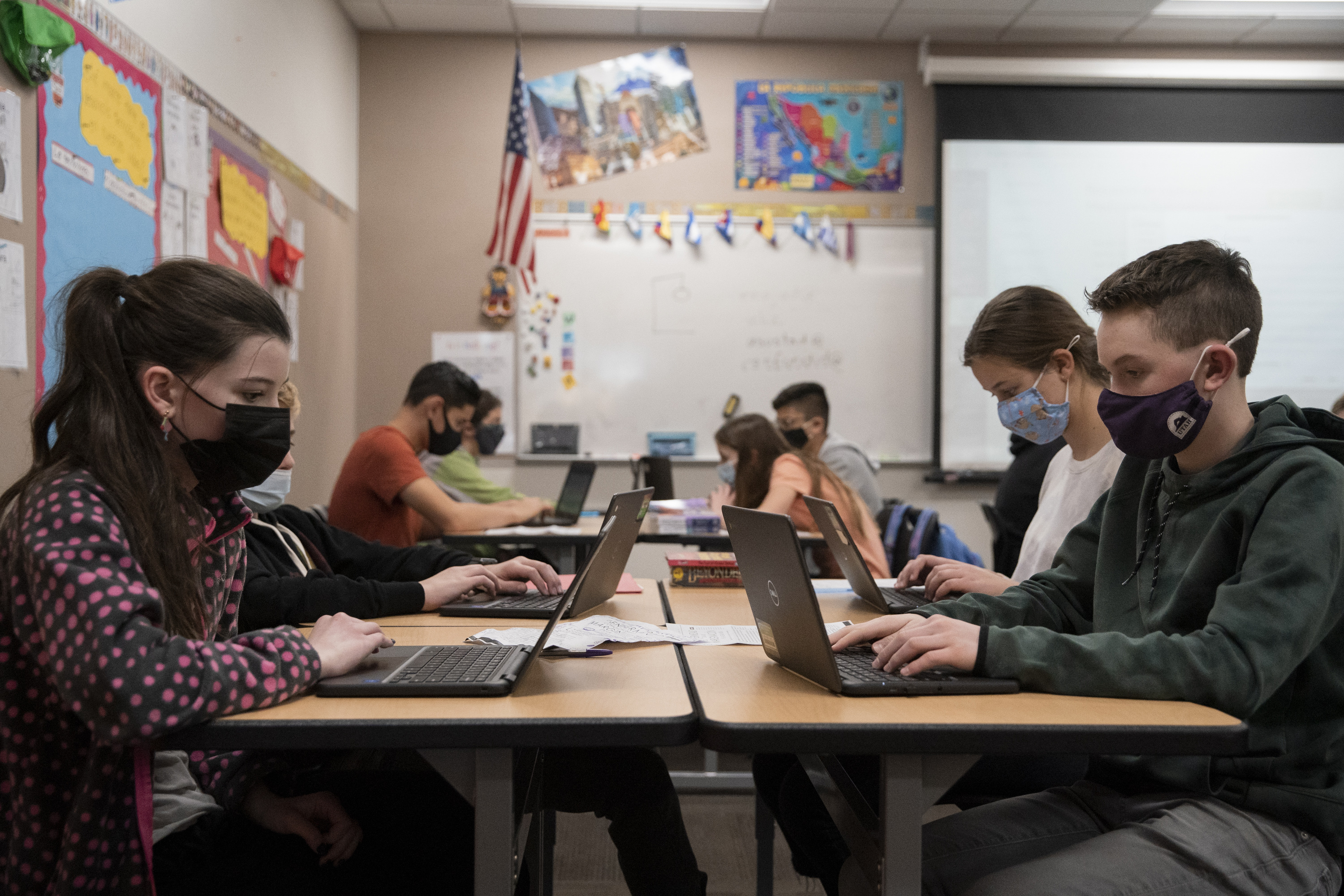 Eighth-grade students at Mount Jordan Middle School in Sandy wear masks during their dual-language class on Jan. 10. Many Utah schools are transitioning to remote learning in the wake of an ongoing rise in COVID-19 cases, which creates challenges for teachers and students. But Utah is in a "unique position" to handle those challenges.