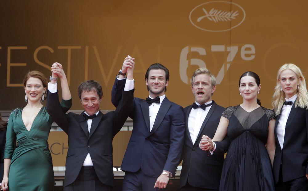 Cast members, from left, actress Lea Seydoux, director Bertrand Bonello, actor Gaspard Ulliel, actor Jeremie Renier, actress Amira Casar and actress Aymeline Valade arrive for the screening of "Saint-Laurent" at the 67th international film festival, Cannes, southern France, on May 17, 2014. Ulliel died Wednesday, after a skiing accident in the Alps, according to his agent's office.