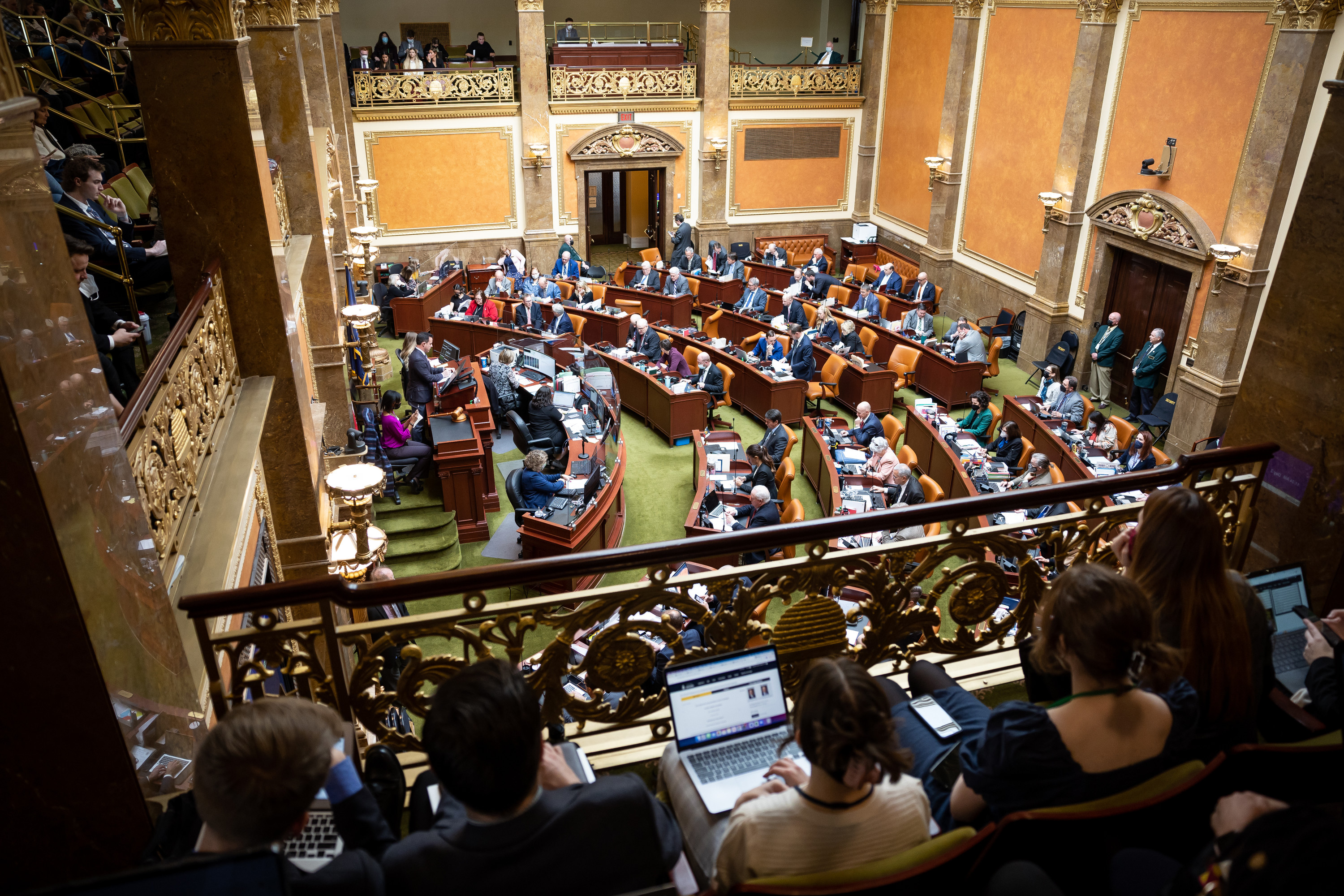 Lawmakers meet in the House chamber at the Capitol in Salt Lake City on the second day of the legislative session. Utah health officials on Wednesday told lawmakers that the omicron variant of COVID-19 will spread regardless of community mitigation efforts, but masks will slow the spread.