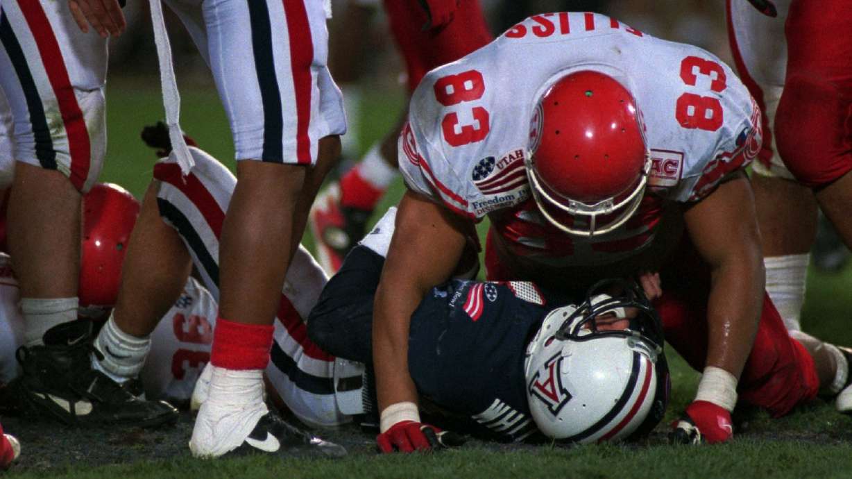 Luther Elliss gets in a few words after sacking Arizona quarterback Dan White.