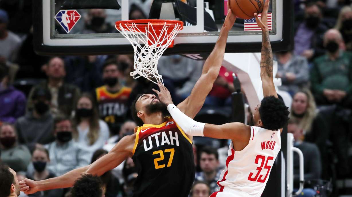 Utah Jazz center Rudy Gobert (27) blocks Houston Rockets center Christian Wood (35) at the basket as the Utah Jazz and the Houston Rockets play at Vivint Arena in Salt Lake City on Wednesday, Jan. 19, 2022.