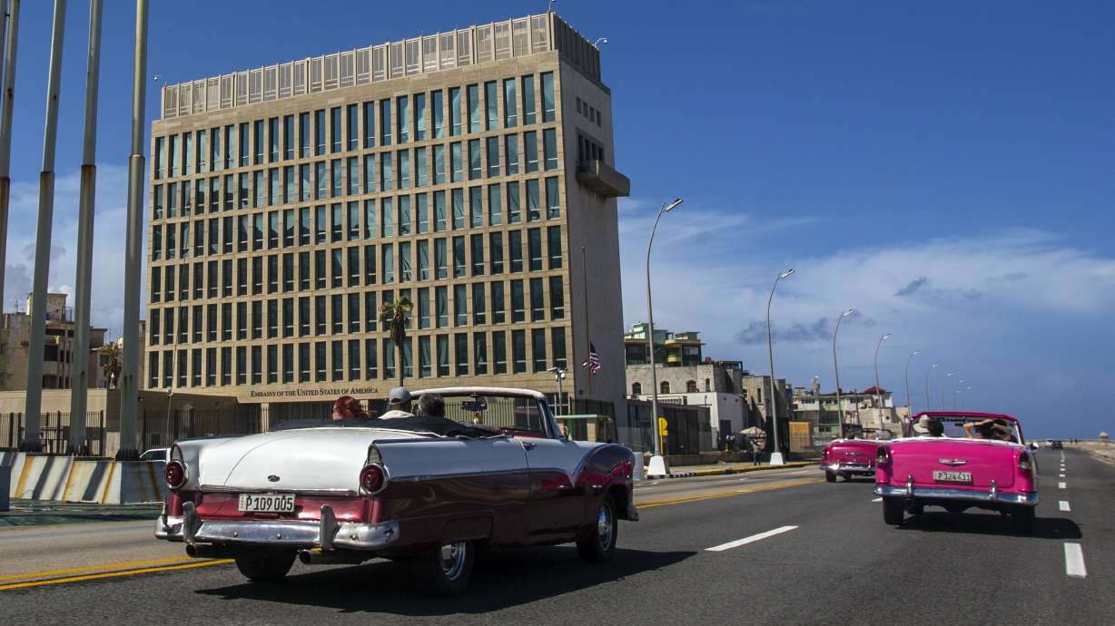 Tourists ride classic convertible cars beside the U.S. Embassy in Havana, Cuba, Oct. 3, 2017. The CIA believes it’s unlikely that Russia or another adversary are broadly using directed energy to attack hundreds of U.S. personnel who have reported brain injuries and symptoms that have come to be known as “Havana syndrome."