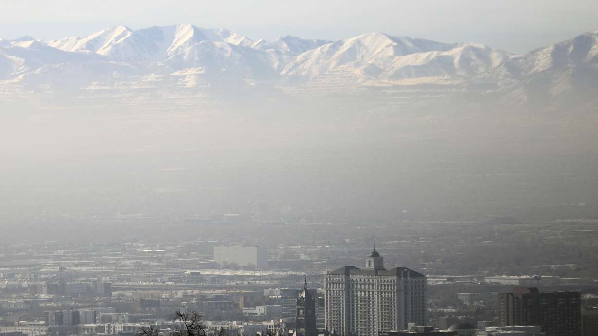 Smog settles over the Salt Lake Valley during an inversion on Wednesday. A storm arriving Thursday night is expected to clear out the smoggy air.