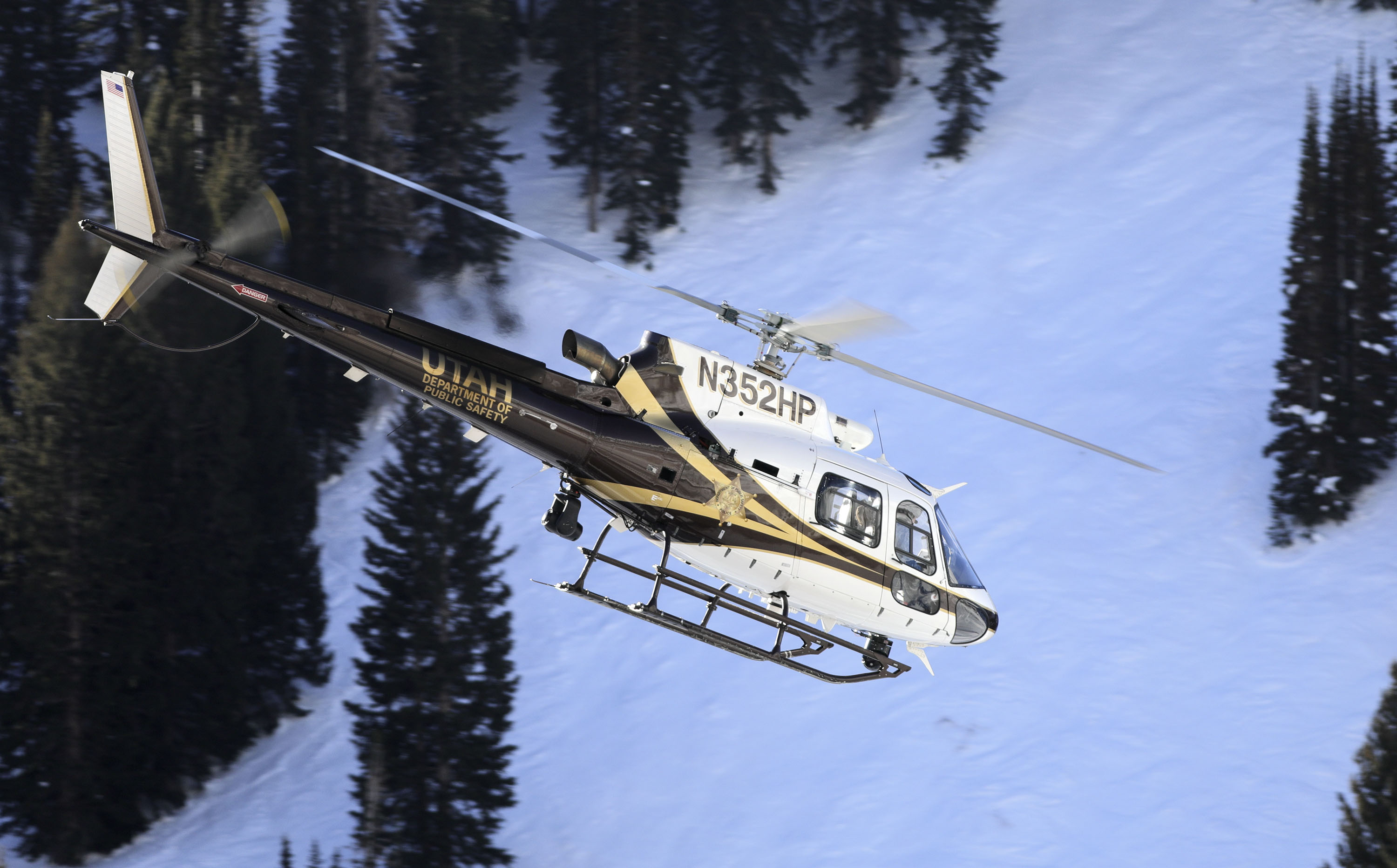 The Utah Department of Public Safety helicopter takes search and rescue crews to look for a 68-year-old male overdue backcountry skier near Alta on Thursday.