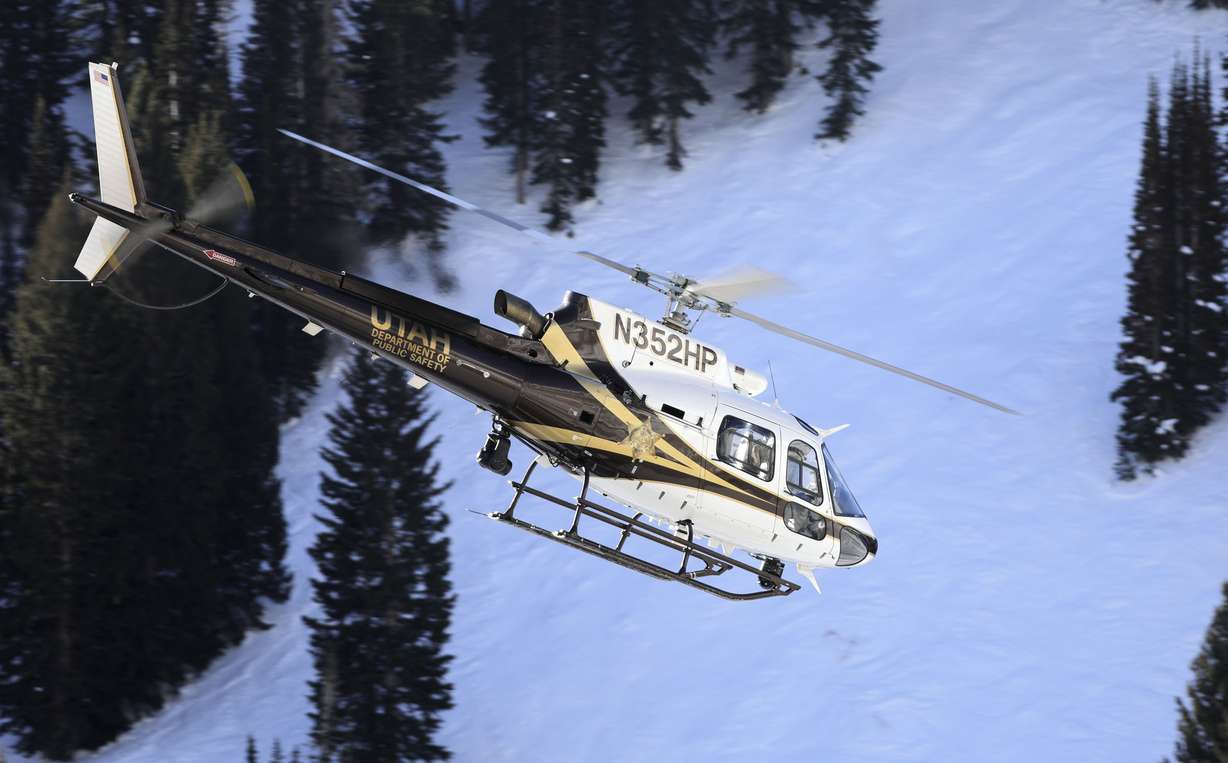 The Utah Department of Public Safety helicopter takes search and rescue crews to look for a 68-year-old male overdue backcountry skier near Alta on Thursday.
