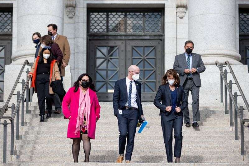House Minority Whip Luz Escamilla, D-Salt Lake City,
Sen. Derek Kitchen, D-Salt Lake City, Sen. Kathleen Riebe,
D-Cottonwood Heights, front row left to right, and House Minority
Leader Brian King, D-Salt Lake City, back right, outline the Democrats’ legislative priorities for the
year at the Capitol in Salt Lake City on Day 3 of the Utah
legislative session, Thursday.