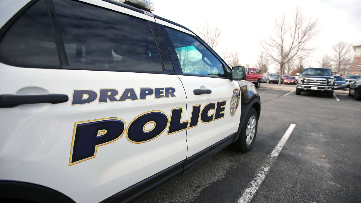 A woman was shot and injured late Wednesday following an exchange of gunfire inside a Draper home, police say.