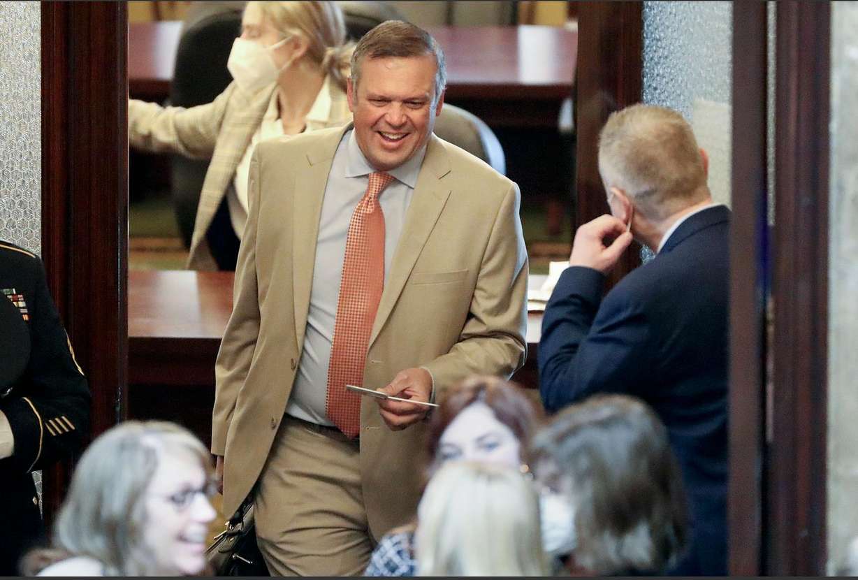 Rep. Mark Strong, R-Bluffdale, carries his COVID-19 rapid test into the House chamber on the first day of the Utah general legislative session at the Capitol in Salt Lake City on Tuesday. Strong tested positive sometime last week.