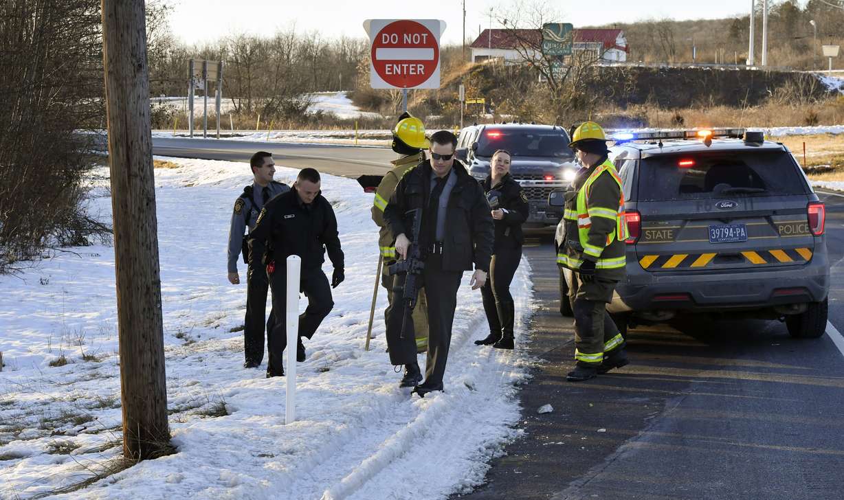 Game Commission Officers pull up as Pennsylvania State Troopers prepare to look for several monkeys which escaped from their crates after the trailer which they were being transported in was involved in a crash on state Route 54 and Interstate 80 near Danville, Pa., Friday, Jan. 21, 2022. They were transporting 100 monkeys and several were on the loose at the time of the photo.