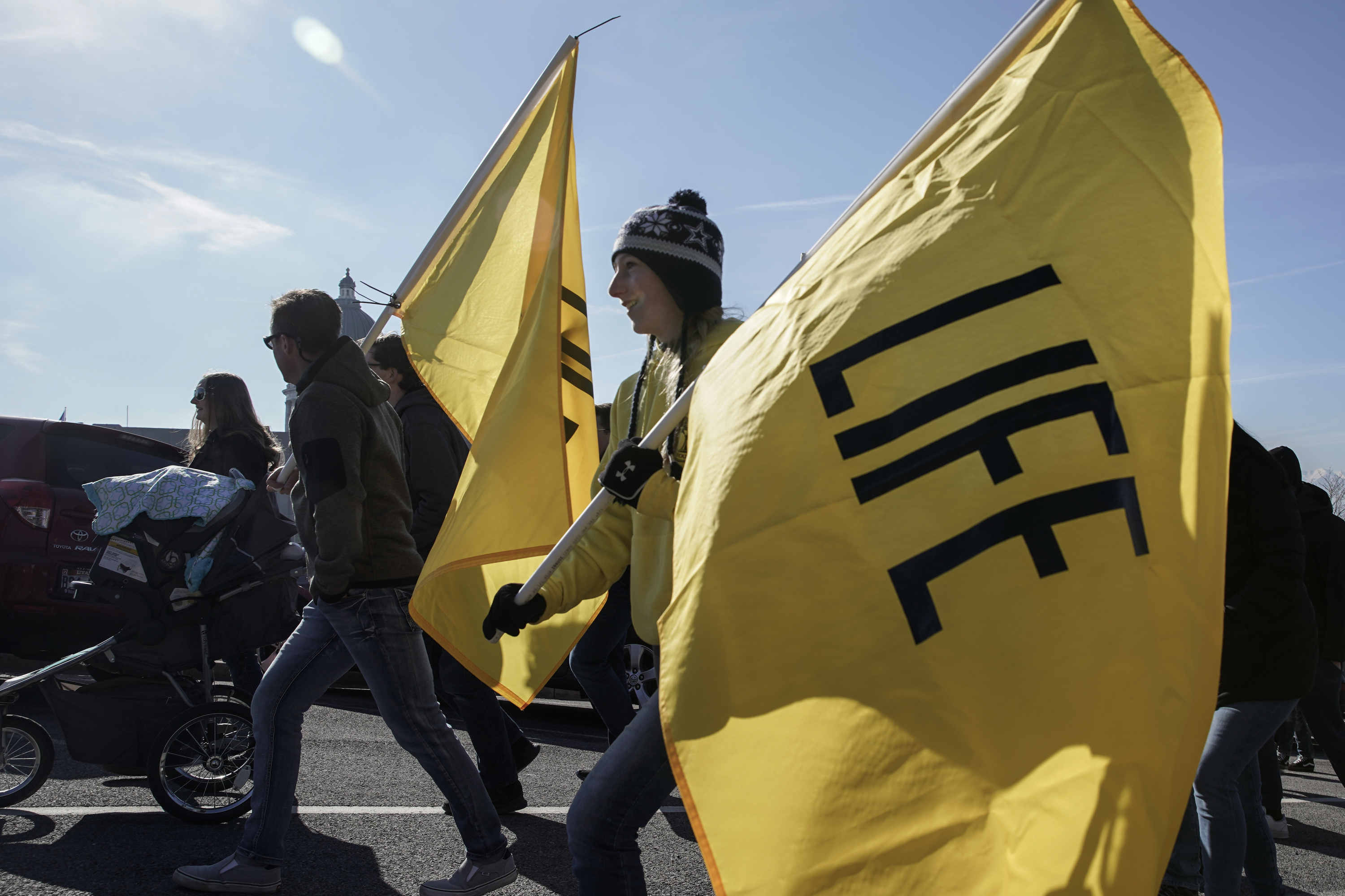 Gemma Wellwerts holds a flag during the March for Life rally outside of the Utah Capitol in Salt Lake City on Saturday.