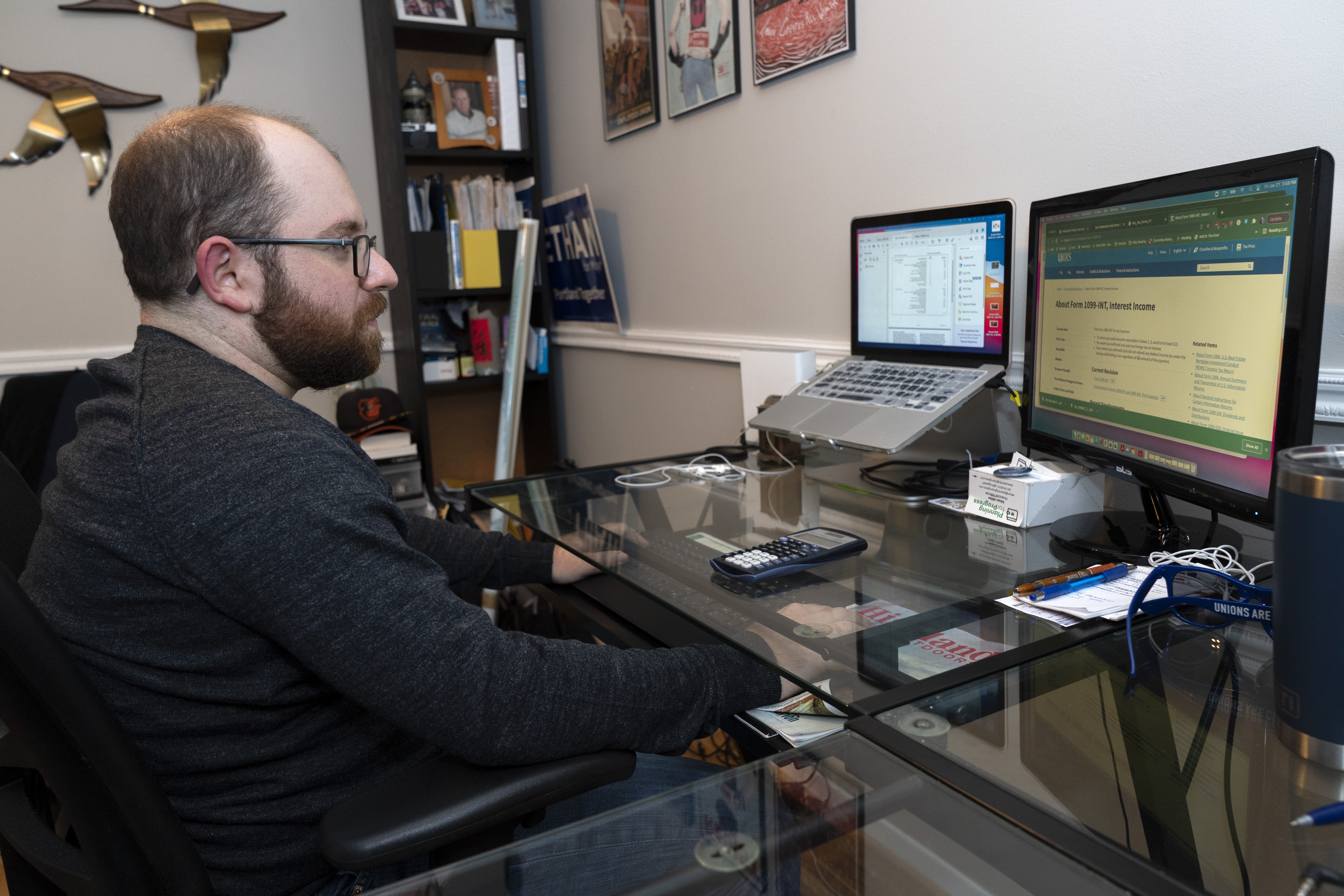 Ethan Miller works on his taxes at home in Silver Spring, Md., on Jan., 21. Tax filing season starts Monday and people can expect the task to be more cumbersome than usual this year thanks to an overloaded and understaffed IRS workforce and new complications from pandemic-related programs.