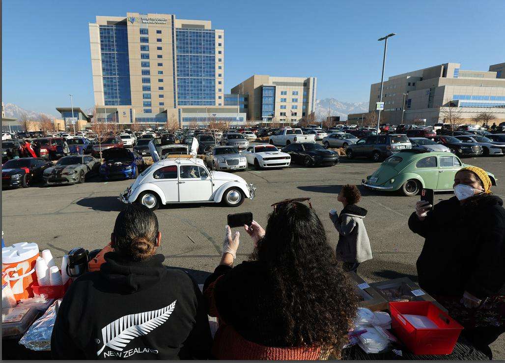 Friends and family sleep in the parking lot of Intermountain Medical Center where shooting victim and Hunter High School student Ephraim Asiata recovers in Murray on Sunday.
