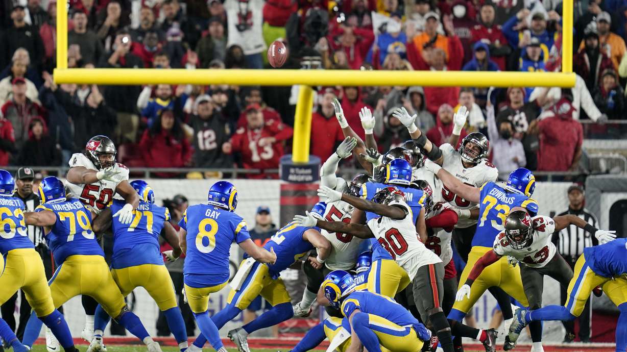 Los Angeles Rams' Matt Gay (8) kicks a 30-yard field goal to defeat the Tampa Bay Buccaneers during the second half of an NFL divisional round playoff football game Sunday, Jan. 23, 2022, in Tampa, Fla.
