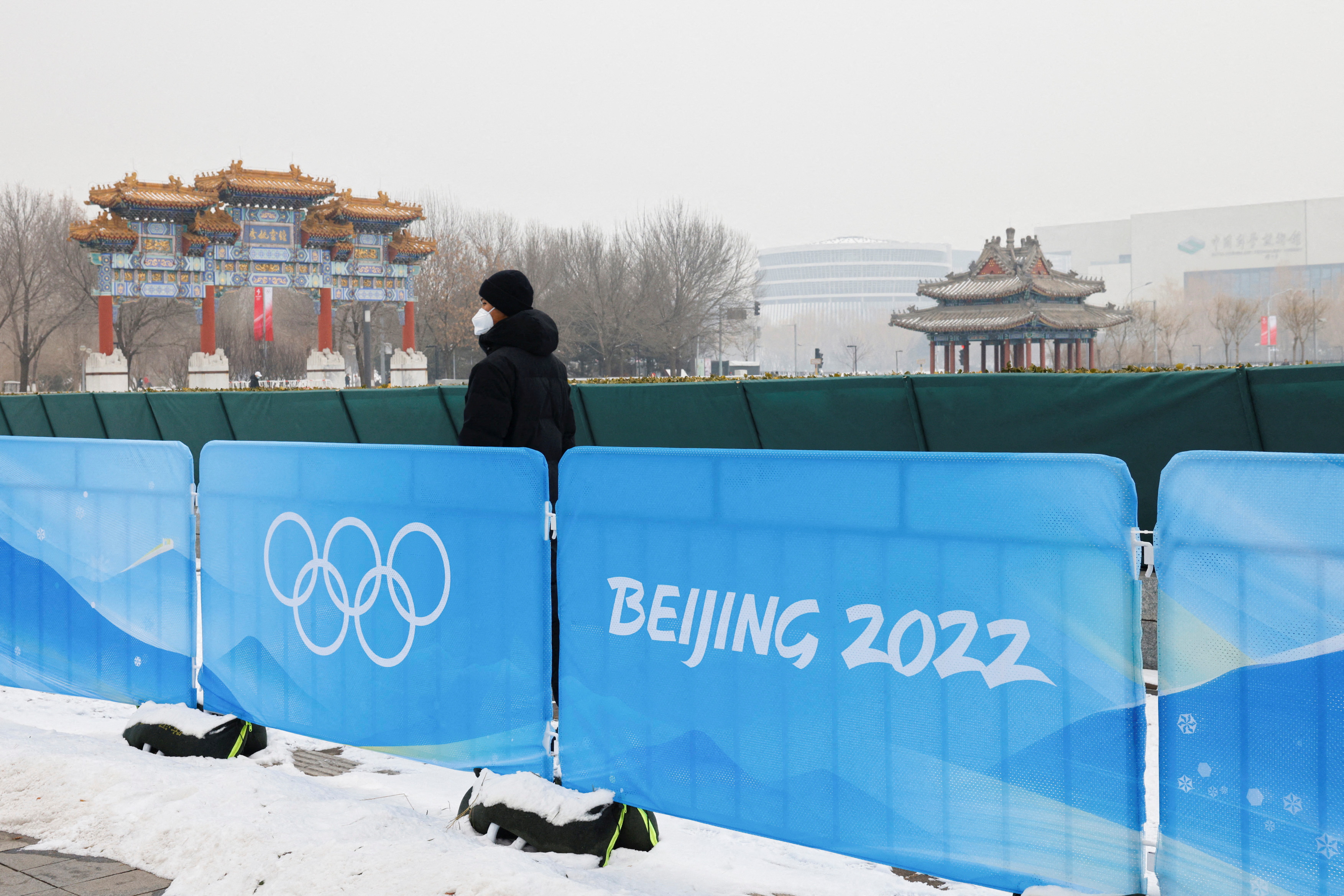 A security guard stands near the closed-loop "bubble" at the Main Press Center ahead of the Beijing 2022 Winter Olympics in Beijing, China, Sunday.