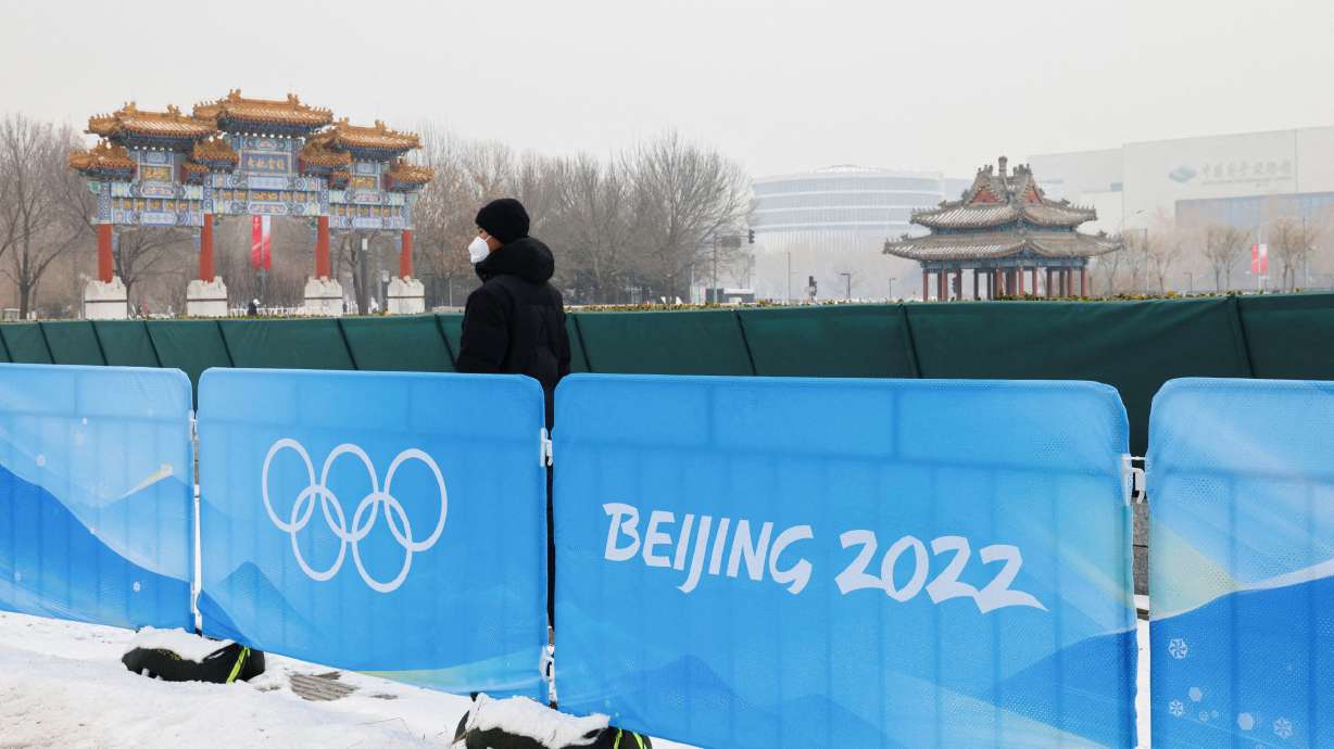 A security guard stands near the closed-loop "bubble" at the Main Press Center ahead of the Beijing 2022 Winter Olympics in Beijing, China, Sunday.