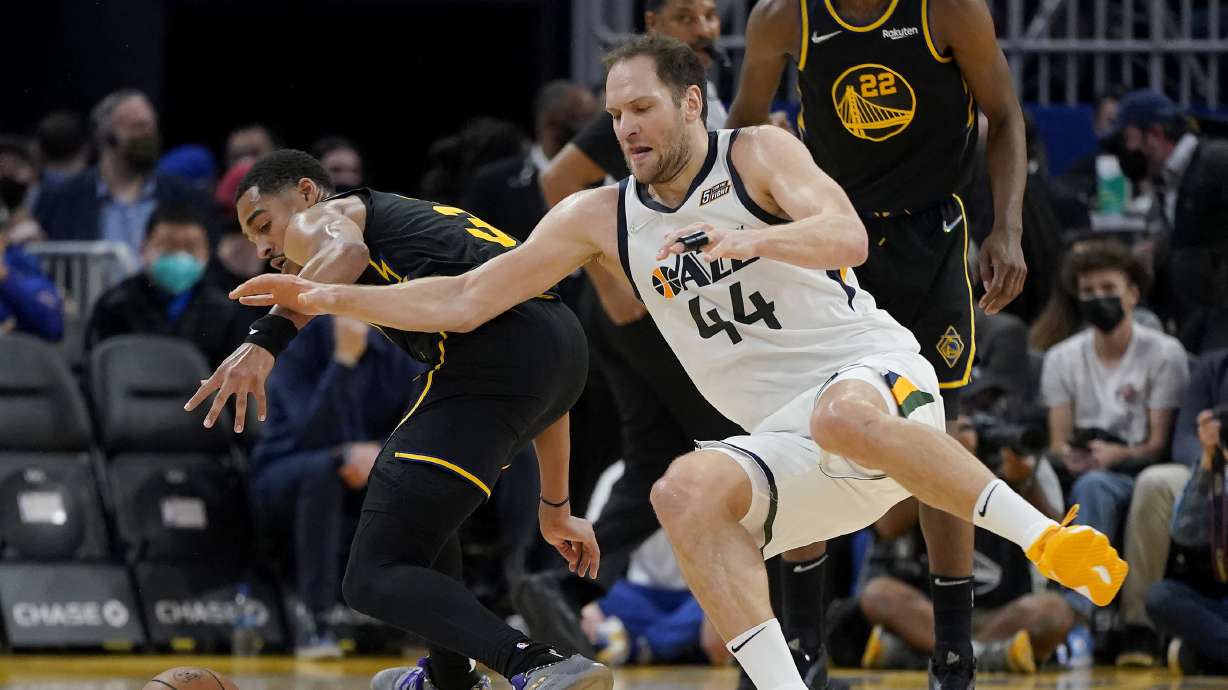 Utah Jazz forward Bojan Bogdanovic (44) loses the ball after being fouled by Golden State Warriors guard Jordan Poole, left, during the first half of an NBA basketball game in San Francisco, Sunday, Jan. 23, 2022.