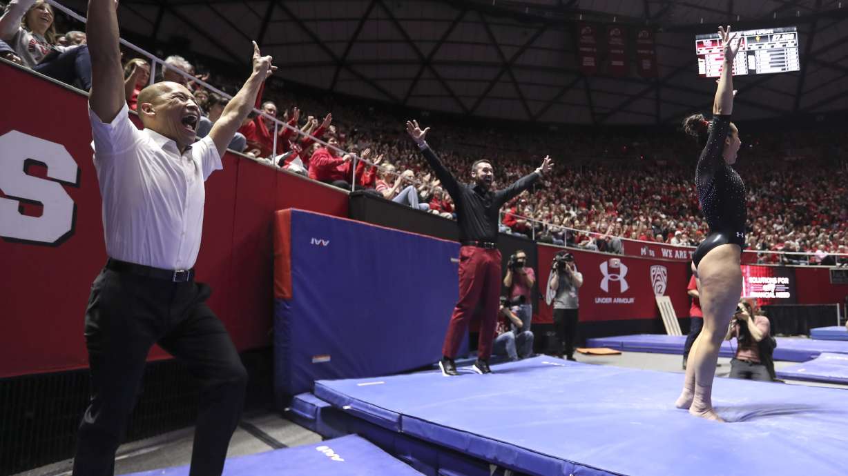 Utah heads coach Tom Farden, left, and assistant coach Garrett Griffeth celebrate Alexia Burch’s vault routine during the Arizona State and University of Utah gymnastics meet at the Huntsman Center in Salt Lake City on Friday, Jan. 24, 2020.