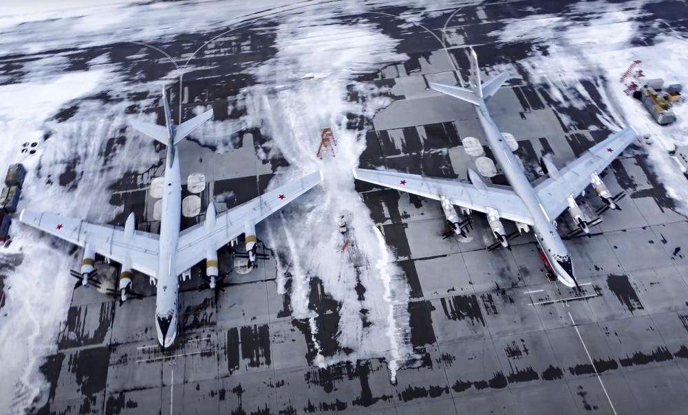 In this image taken from video provided by the Russian Defense Ministry Press Service, a pair of Tu-95 strategic bombers of the Russian air force are parked at an air base in Engels near the Volga River in Russia, Monday.