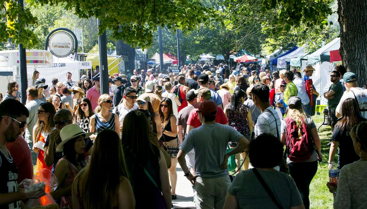 Shoppers take in the opening day of the farmers market Saturday, June 13, 2015, in Salt Lake City at Pioneer Park.