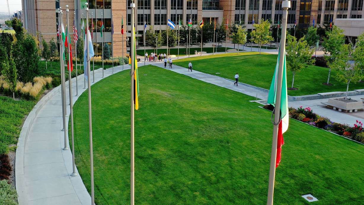 Missionaries walk between class at the Missionary
Training Center in Provo, Aug. 26, 2021. A large group
of Latter-day Saint missionaries became Kiribati’s first COVID-19
cases when they tested positive on arrival back home earlier this
month after returns already long delayed by the pandemic.