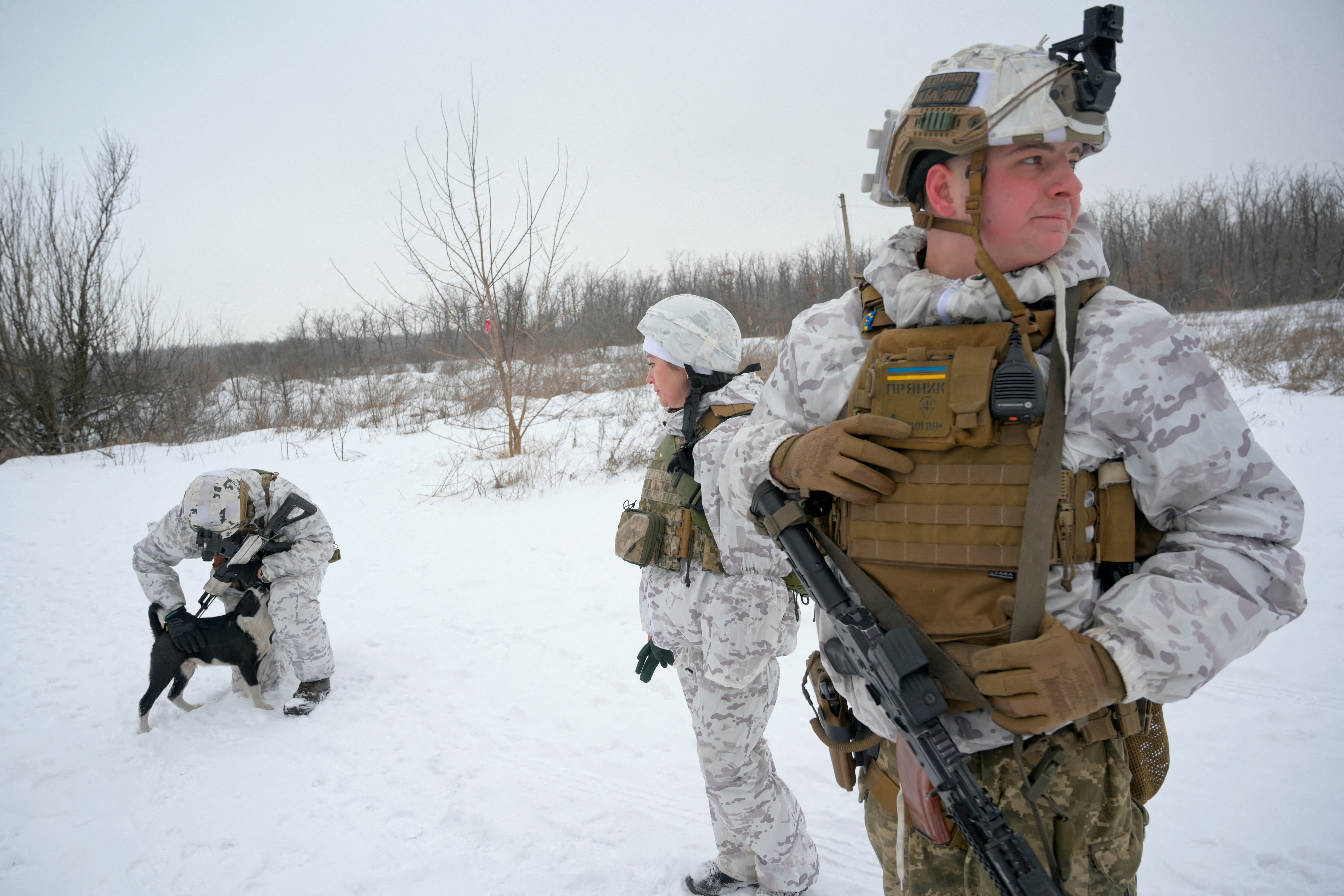 Service members of the Ukrainian armed forces are seen at combat positions near the line of separation from Russian-backed rebels outside the town of Avdiivka in Donetsk Region, Ukraine, on Tuesday.