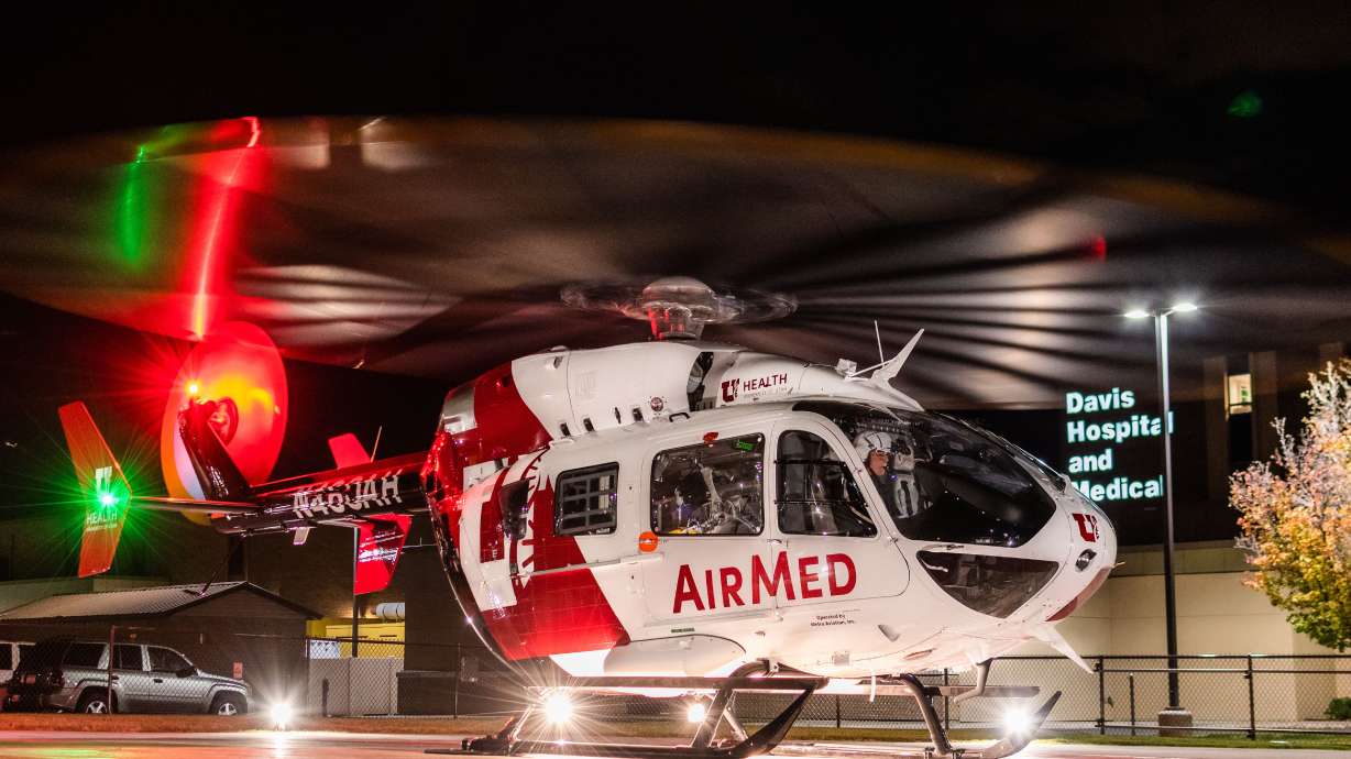 An AirMed helicopter lands at night. University of Utah AirMed Program Manager Frankie Toon said on Tuesday that in the last few weeks a helicopter was hit twice with lasers from the ground.
