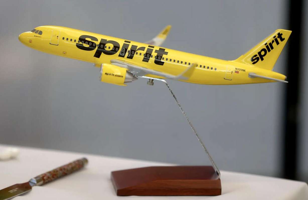 A model Spirit Airlines plane is on display at a press conference held to announce that Spirit Airlines will begin service to and from Salt Lake City in May, at Salt Lake City International Airport in Salt Lake City on Tuesday, Jan. 25, 2022.