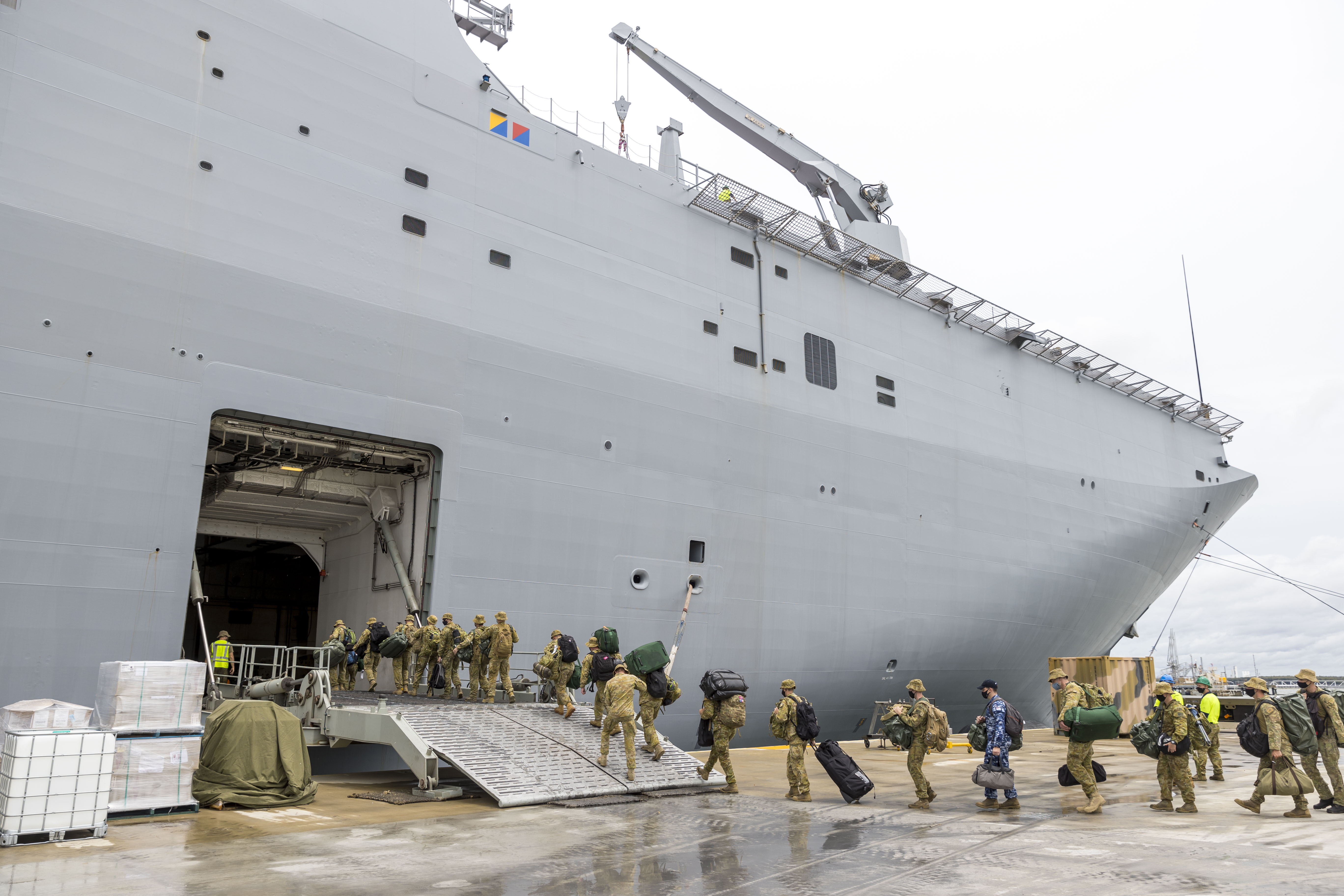 Soldiers load onto HMAS Adelaide at the Port of Brisbane before departing for Tonga Jan. 20, after a volcano eruption.