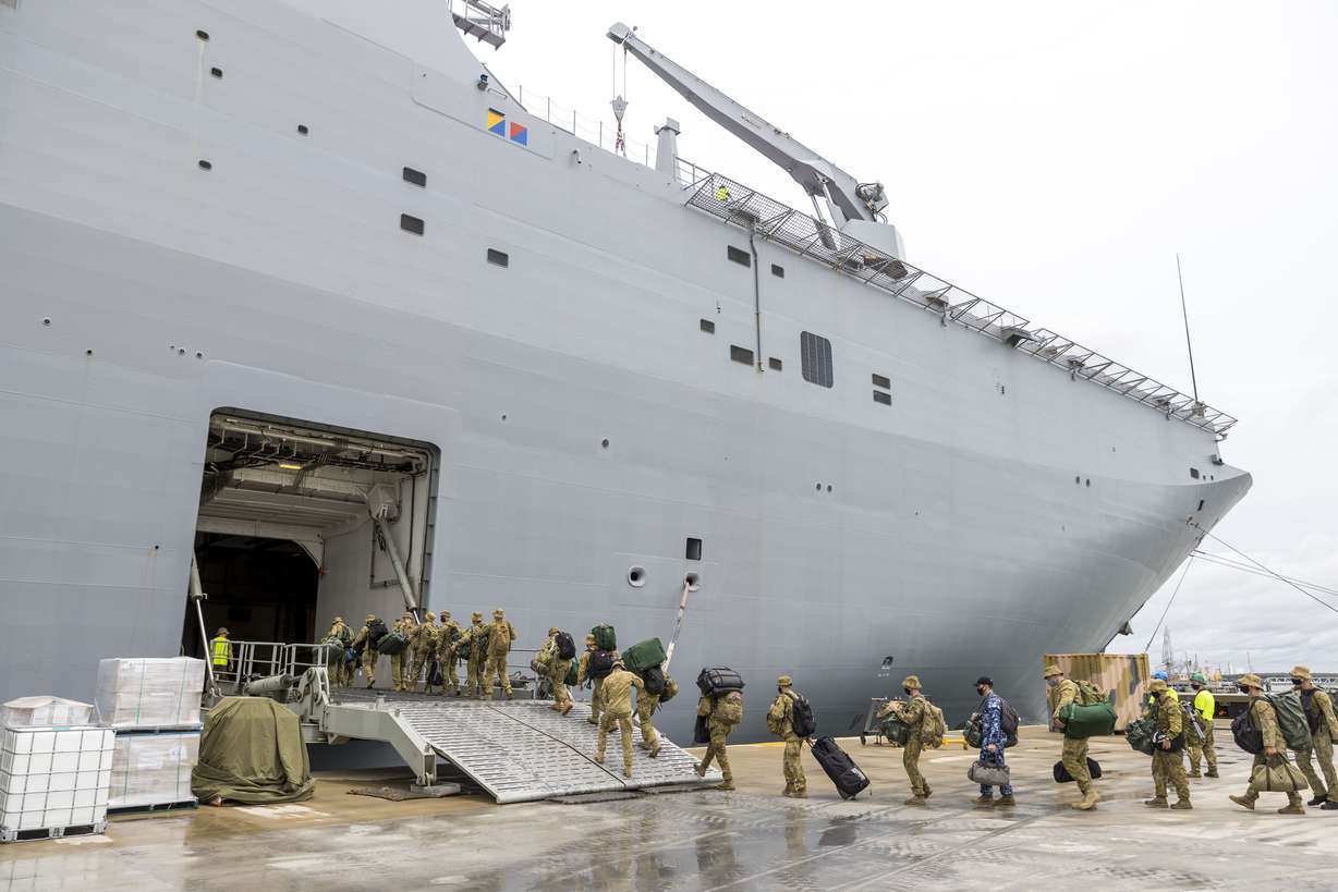 Soldiers load onto HMAS Adelaide at the Port of Brisbane before departing for Tonga Jan. 20, after a volcano eruption.