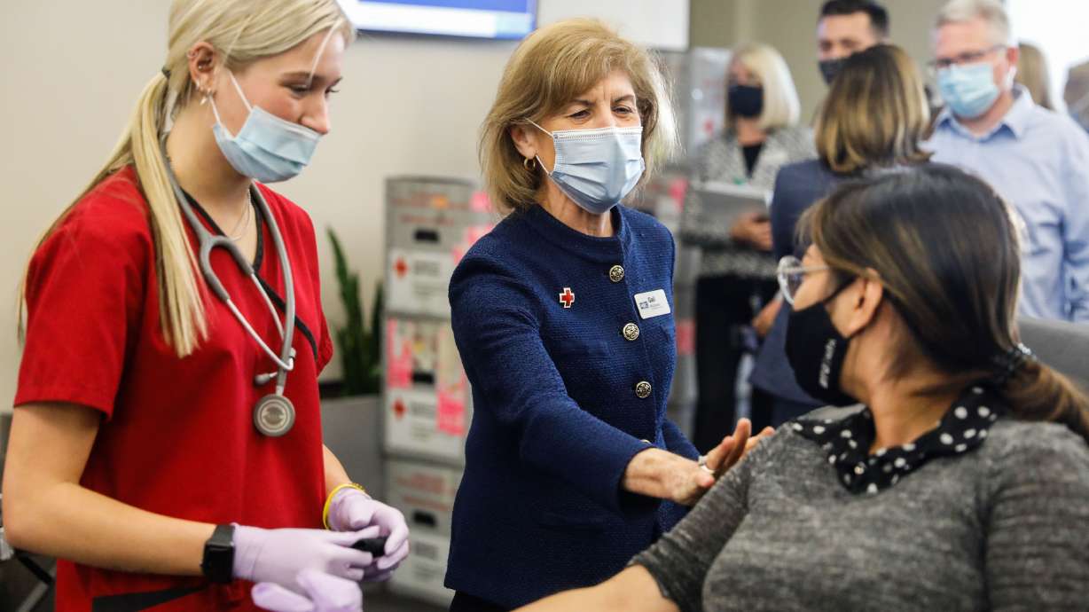 American Red Cross President and CEO Gail McGovern, center talks to a donor during a visit to a Red Cross blood drive at BYU in Provo on Sept. 24, 2021. The Red Cross is facing a shortage of blood donations in early 2022, and is asking for more people to donate.