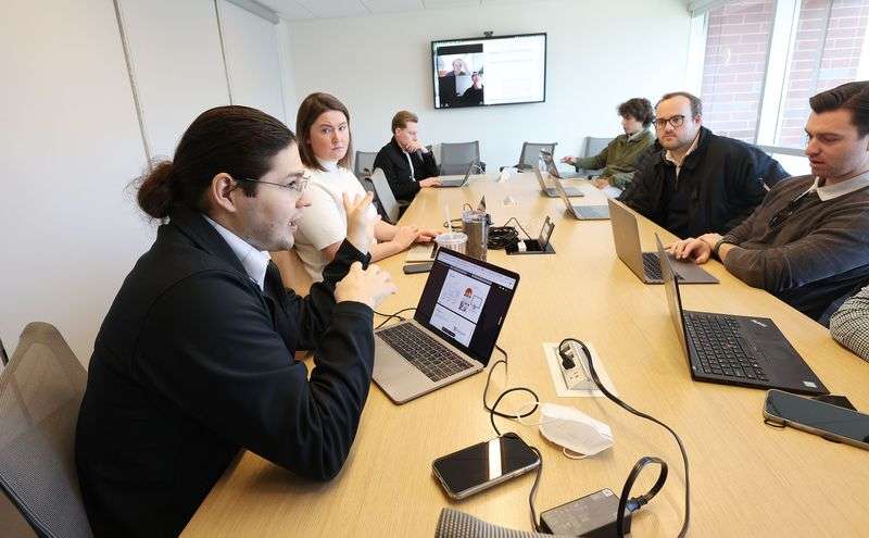 Sorenson Impact Center staffer Jose Moreno, left, meets
with students to review applicants for a new $5 million fund at the
University of Utah in Salt Lake City on Tuesday.