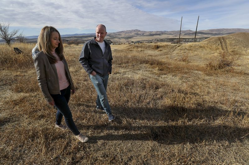 Utah first lady Abby Cox and her husband, Gov Spencer
Cox, walk on their family’s farmland near their home in Fairview,
Sanpete County, on Wednesday, Dec. 9, 2020.