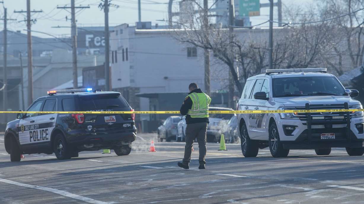 Salt Lake police work at the scene of a fatal automobile-pedestrian accident at 900 West in Salt Lake City on Friday.