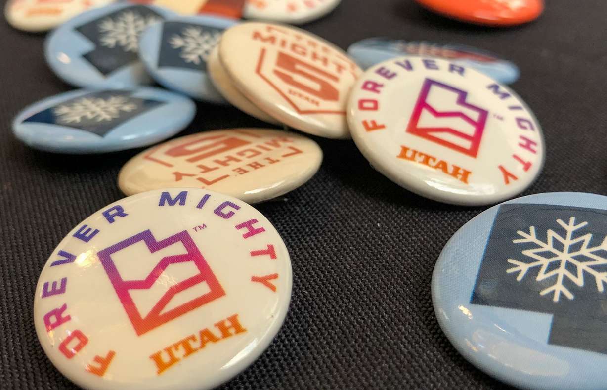 Forever Mighty and Mighty 5-themed pins at a Utah Office of Tourism booth inside the Utah Capitol Friday. Forever Mighty, launched last year, is the newest outdoor tourism campaign.