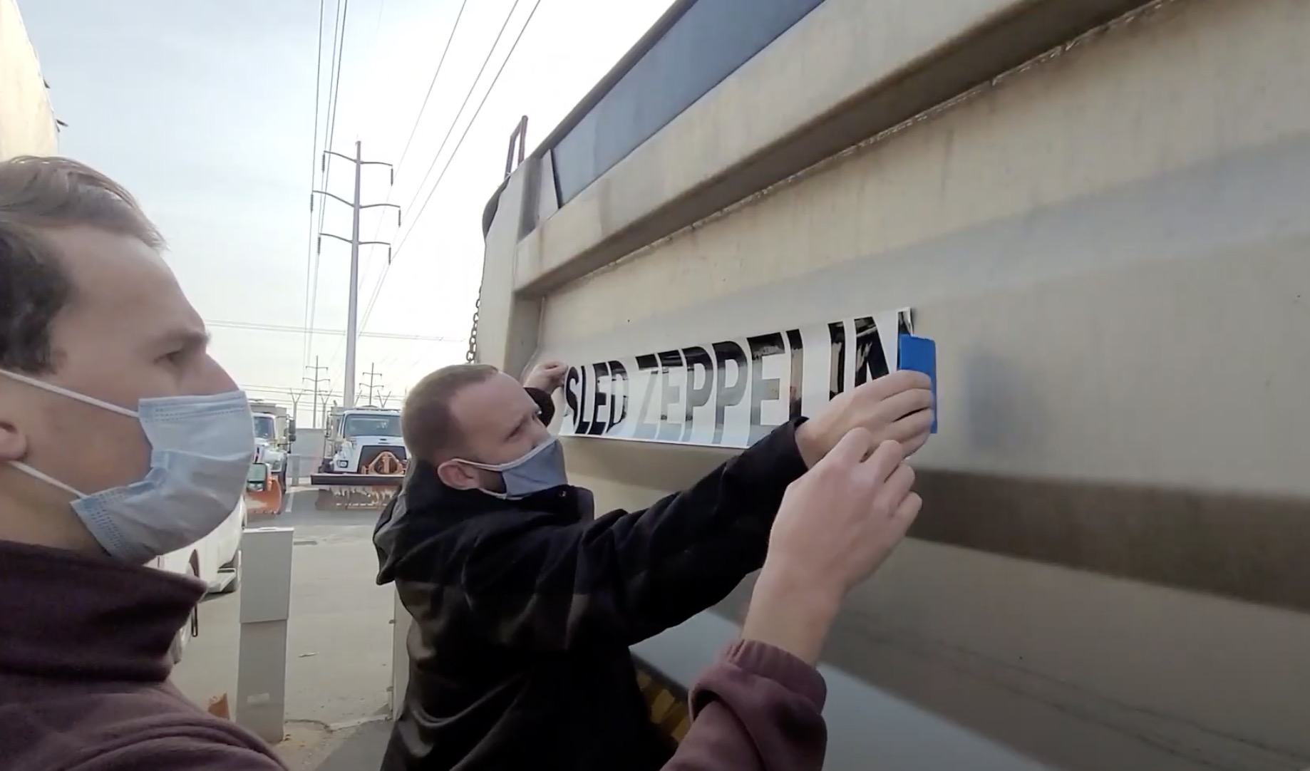 Crews place a sticker naming one of Salt Lake City's plows "Sled Zeppelin." City transportation officials said Friday that it was the top vote-getter in a recent poll to name its vehicle fleet.