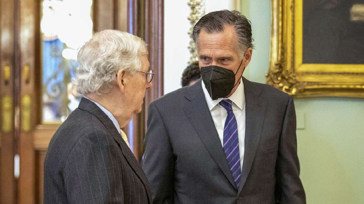 Senate Minority Leader Mitch McConnell, R-Ky., left,
speaks to Sen. Mitt Romney, R-Utah, at the Capitol in Washington,
Thursday, Jan. 13.